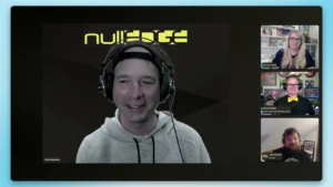 Screenshot of the nullEDGE 2025 Opening Remarks video call, showing four speakers on screen with the yellow nullEDGE logo in the background.